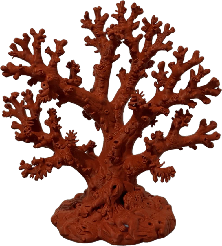 Orange branching coral reef sculpture on a textured seabed base