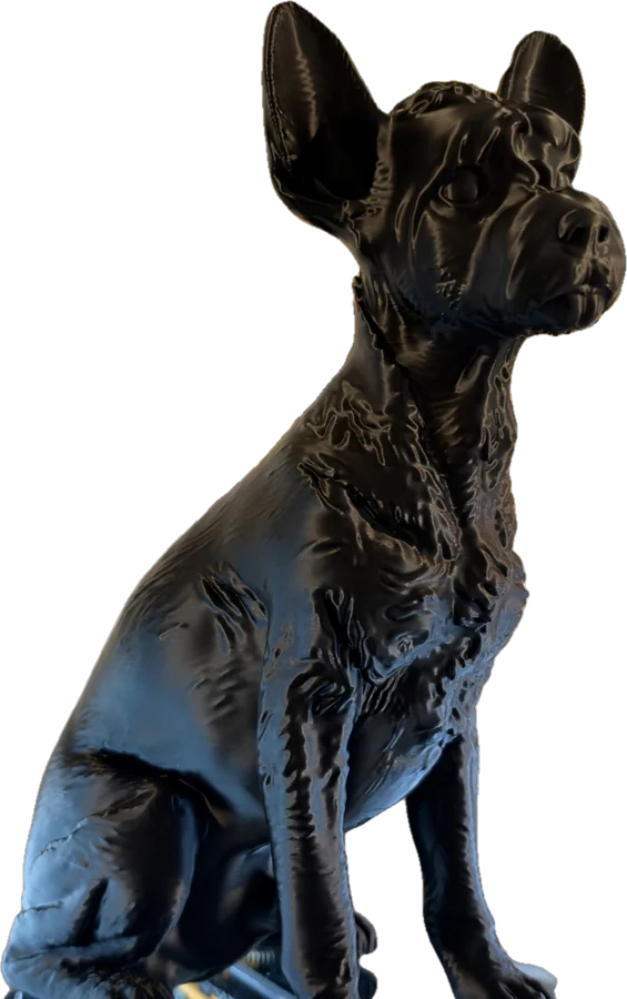 Matte black seated dog sculpture
