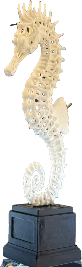 White lattice seahorse on a black pedestal