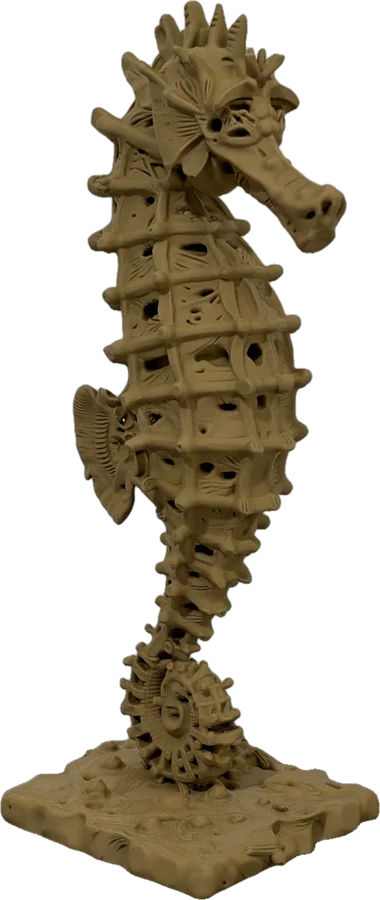 Wood-colored seahorse sculpture with ribbed open body and curled tail on a textured base